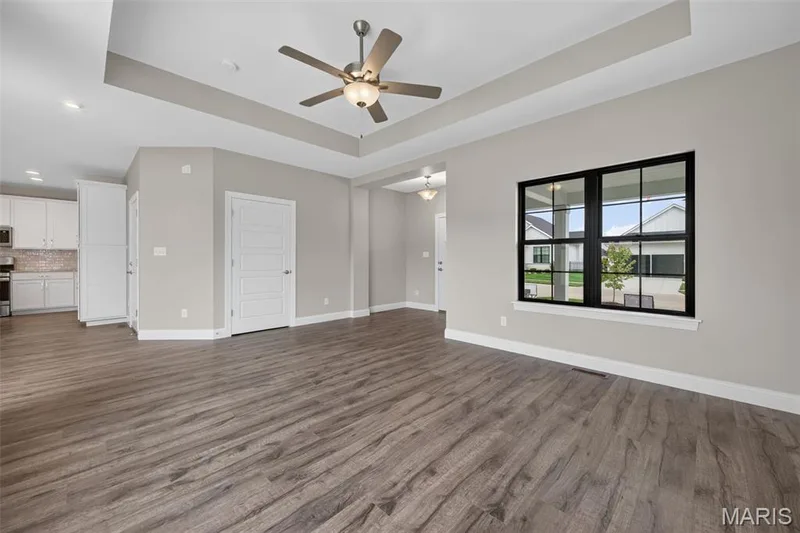 Living Room with Tray Ceiling and Luxury Vinyl Plank Flooring — 146 Haven Ridge Court, Dardenne Prairie, MO 63368