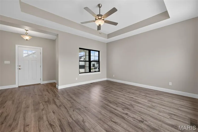 Living Room with Tray Ceiling and Luxury Vinyl Plank Flooring — 146 Haven Ridge Court, Dardenne Prairie, MO 63368