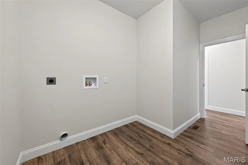 Main Floor Laundry Room with Luxury Vinyl Plank Flooring — 146 Haven Ridge Court, Dardenne Prairie, MO 63368