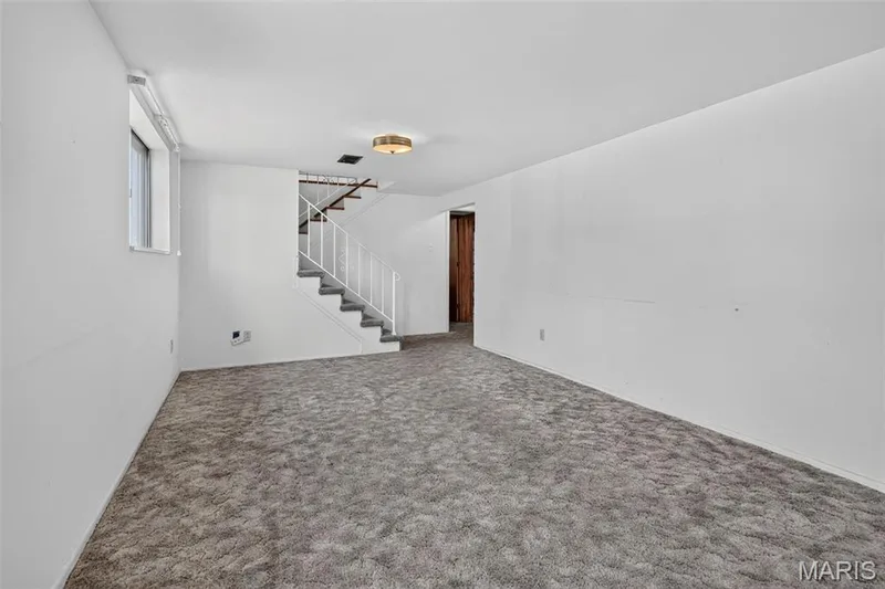 stairs to lower level family room — 16 Saint Michael Drive, St Peters, MO 63376