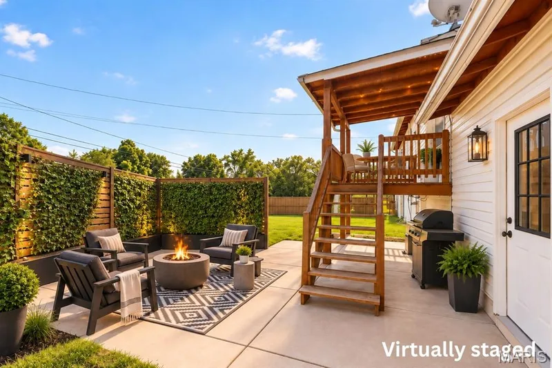 the sky is the limit on what you could do with this flat back yard/patio area- shown here with firepit and landscaping screens — 16 Saint Michael Drive, St Peters, MO 63376