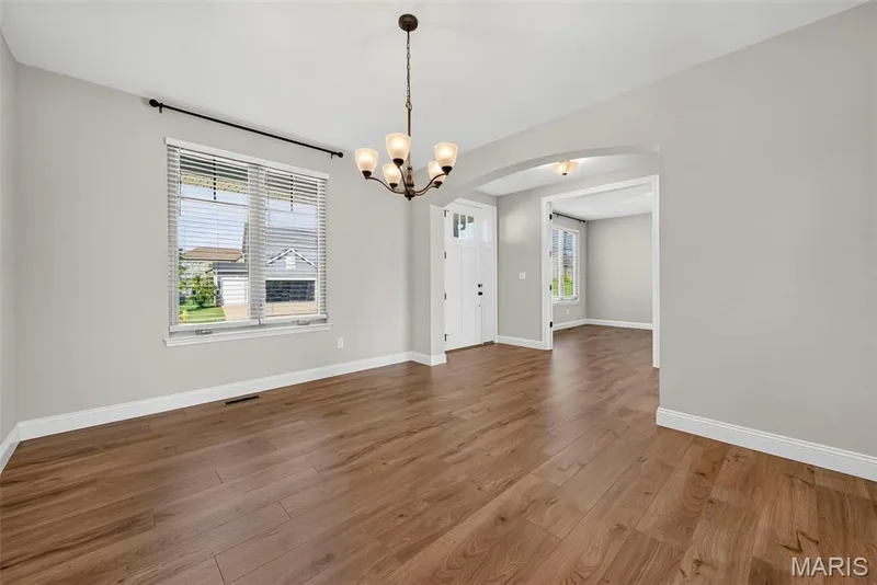 Dining Room with Arched Opening to Entry Foyer — 106 Downview Drive, O'Fallon, MO 63368