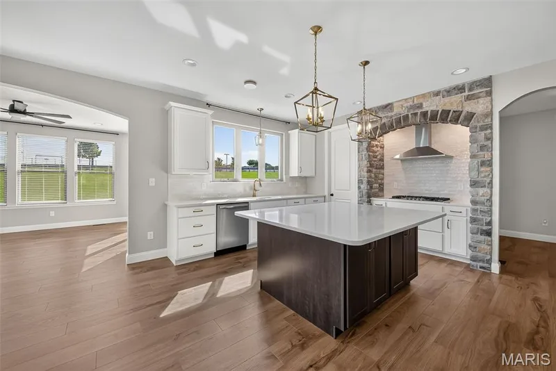 Large Kitchen Island with Quartz Countertops and Seating Bar — 106 Downview Drive, O'Fallon, MO 63368
