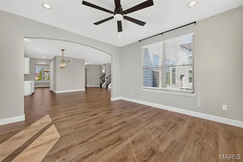 Sun/ Hearth Room with Arched Opening to Breakfast Room — 106 Downview Drive, O'Fallon, MO 63368