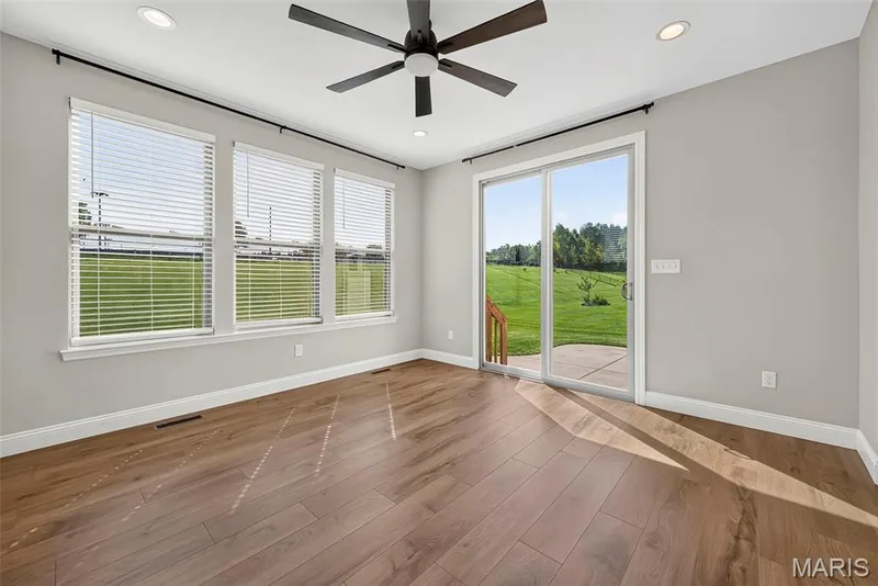 Sun/Hearth Room with Sliding Glass Door Opening to the Patio — 106 Downview Drive, O'Fallon, MO 63368