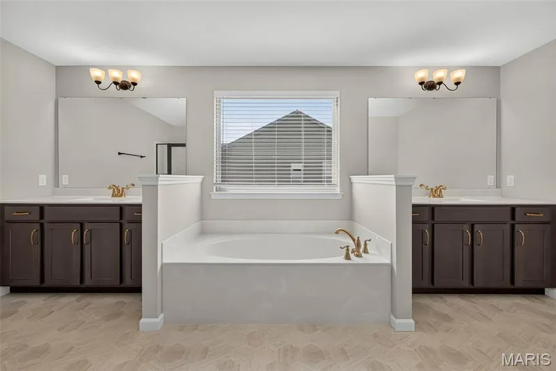 Split Raised Height Vanities and Soaking Tub in Primary Bath — 106 Downview Drive, O'Fallon, MO 63368