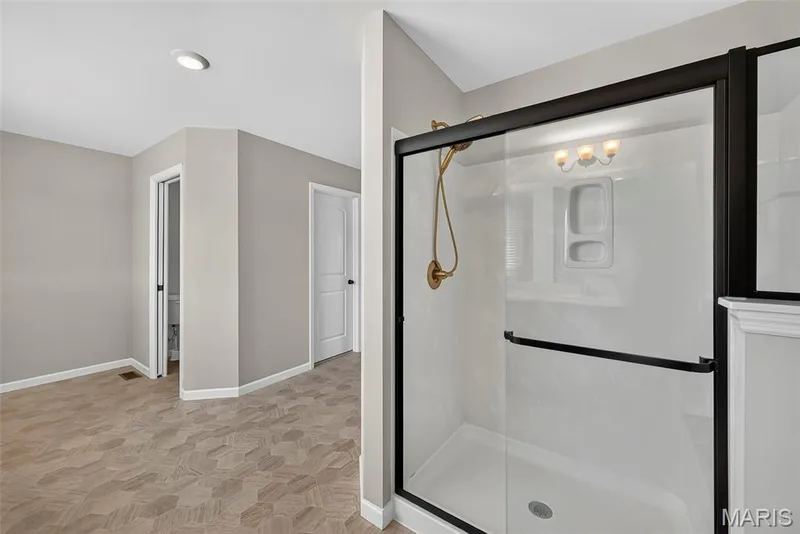 Shower with Marble Surround in Primary Bath — 106 Downview Drive, O'Fallon, MO 63368