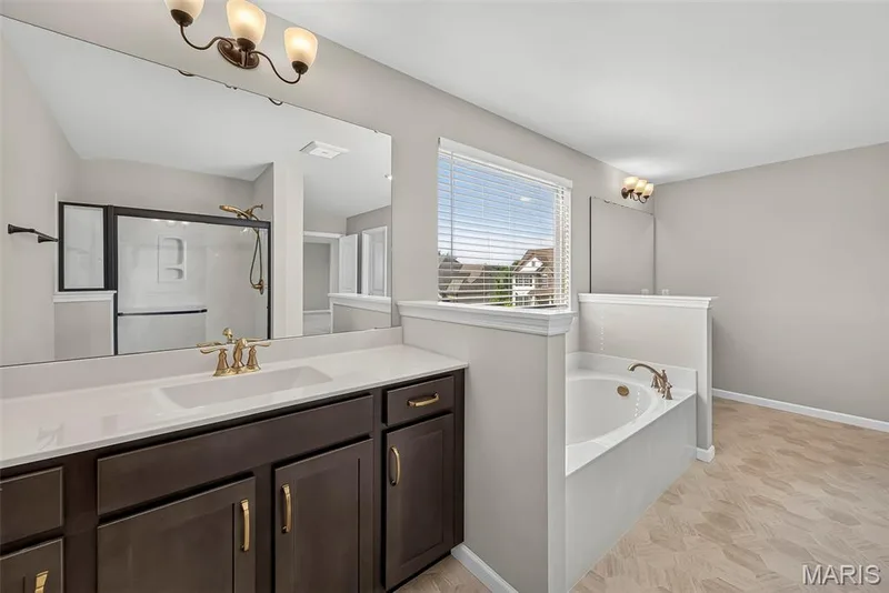 Split Raised Height Vanity, Shower and Soaking Tub in Primary Bath — 106 Downview Drive, O'Fallon, MO 63368
