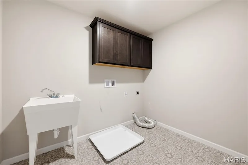Laundry Room with Wash Sink conveniently located on the Second Floor — 106 Downview Drive, O'Fallon, MO 63368