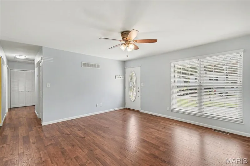 Lovely leaded-glass front door and huge windows leave the living room flooded with natural light ! — 39 Oxbow Road, St Peters, MO 63376