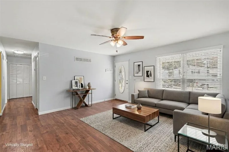 Virtually staged -Notice the coat closet across the hall from second kitchen access and huge linen closet at the end of the hall! — 39 Oxbow Road, St Peters, MO 63376