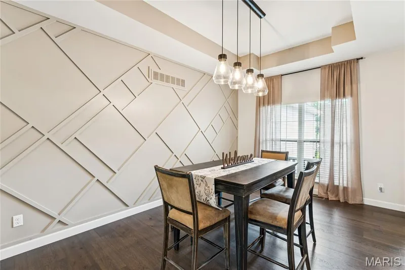 Accent wall featuring geometric paneling — 5 Timberdel Place, Foristell, MO 63348