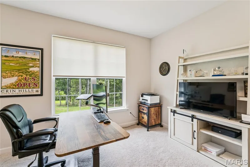 Recessed lighting, light-toned carpeting, and a large window with roller shades — 5 Timberdel Place, Foristell, MO 63348