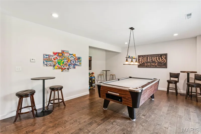 and/or designed for 4th Bedroom, recessed ceiling lighting illuminates a spacious room featuring luxury vinyl flooring, floor to ceiling windows — 5 Timberdel Place, Foristell, MO 63348