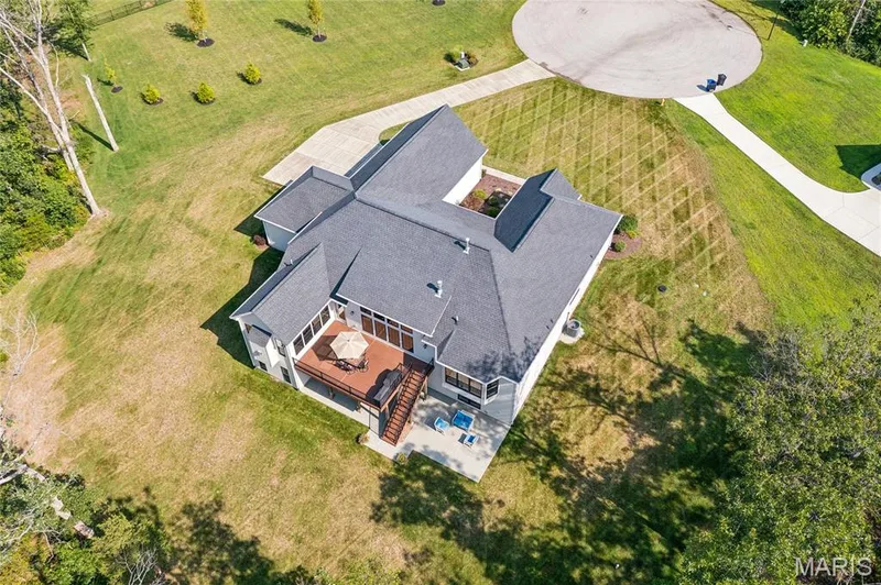 Expansive 3-acre property with a multi-level deck and lower patio — 5 Timberdel Place, Foristell, MO 63348