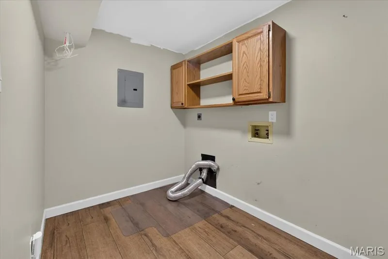 Wood-finish flooring with white trim — 1608 Lake Knoll Drive #1A, Lake St. Louis, MO 63367