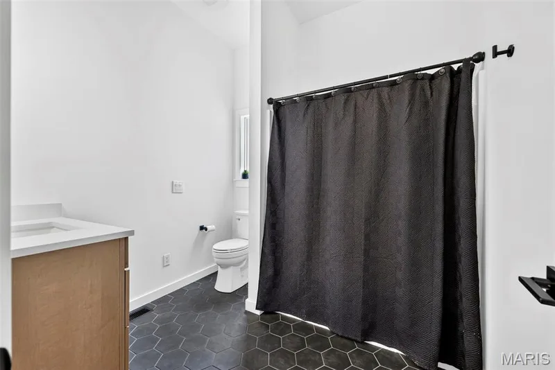 White walls with hexagonal dark-tiled flooring — 3 Millers Court, O'Fallon, MO 63366