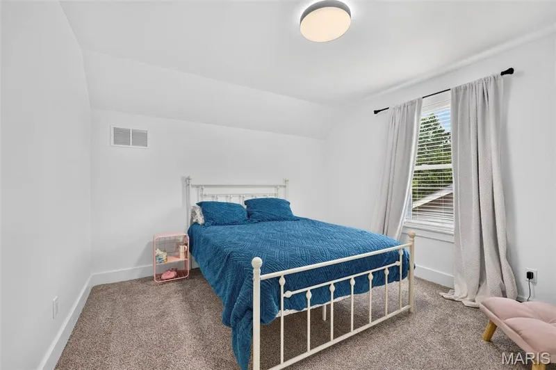 Carpeted flooring, vaulted ceiling, recessed lighting, and a window with blinds — 3 Millers Court, O'Fallon, MO 63366
