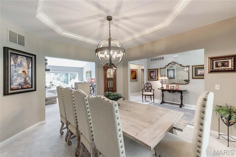 Dining Area open to the Great room and kitchen beyond — 4484 Kingfisher Court, Augusta, MO 63332
