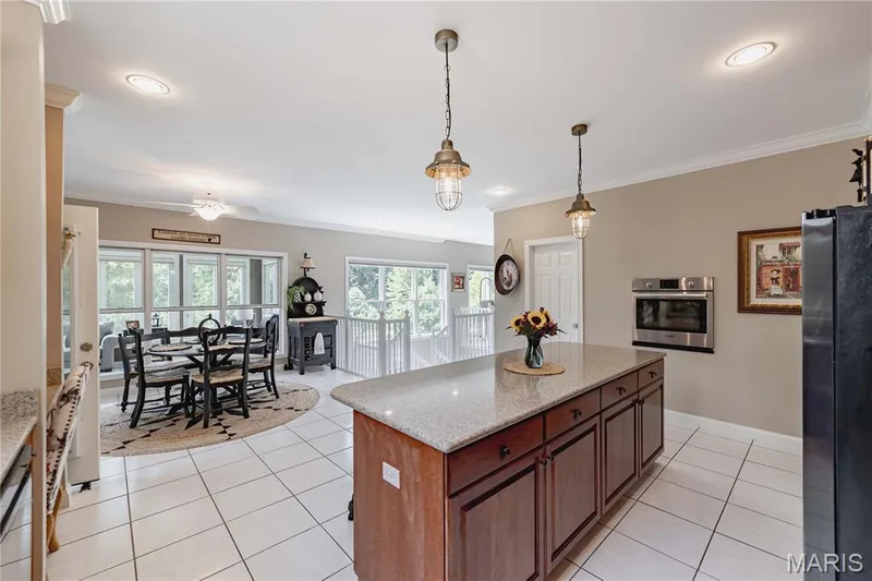 Chefs dream kitchen overlooking the atrium windows and lake — 4484 Kingfisher Court, Augusta, MO 63332