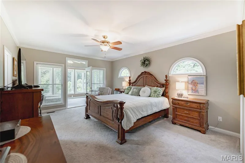 Primary Bedroom with dual walk in closets, private sunporch and ensuite bath — 4484 Kingfisher Court, Augusta, MO 63332