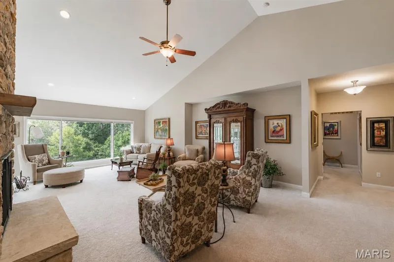 Great room with vaulted ceilings, gas fireplace and stone surround (new 2023) — 4484 Kingfisher Court, Augusta, MO 63332