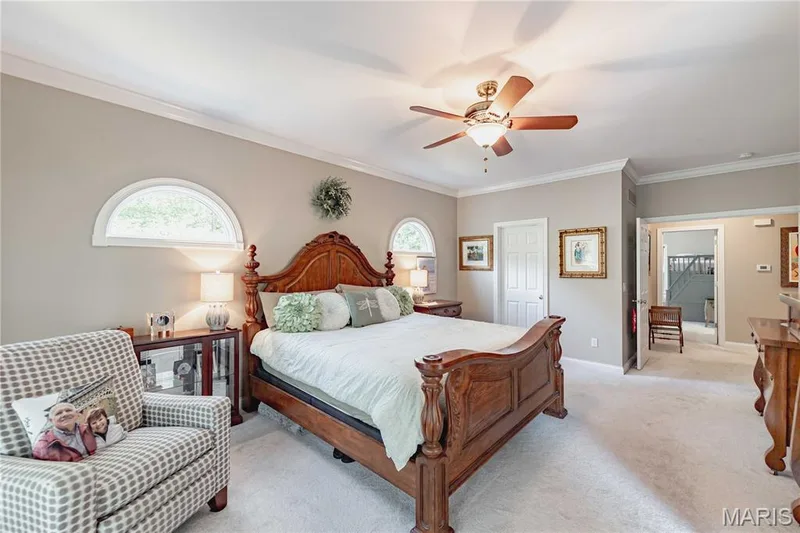 Primary Bedroom with dual walk in closets, private sunporch and ensuite bath, double door entry. — 4484 Kingfisher Court, Augusta, MO 63332