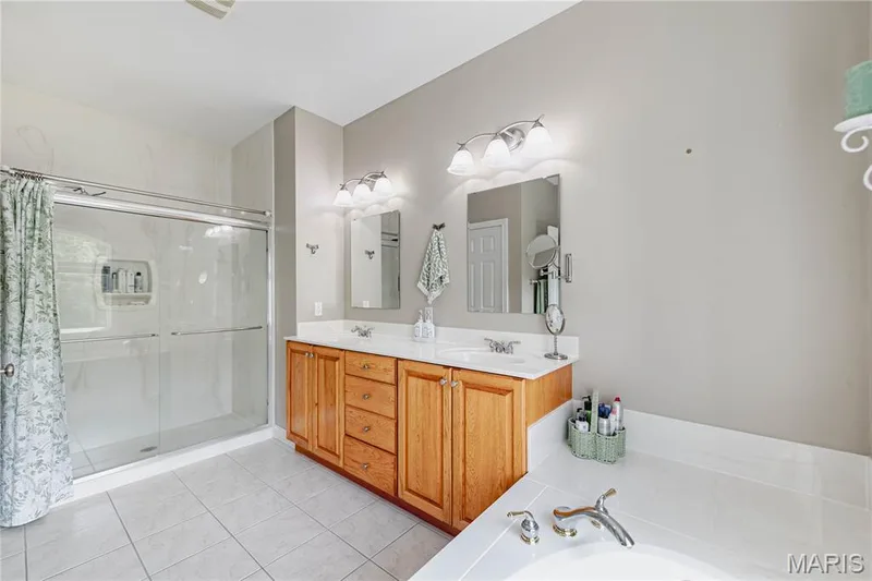 Primary Bedroom Ensuite Bath with dual vanity, walk in shower, separate water closet and soaking tub — 4484 Kingfisher Court, Augusta, MO 63332