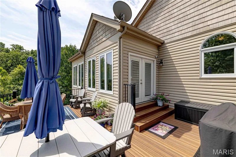 Newer composite deck with access to the sunroom and kitchen — 4484 Kingfisher Court, Augusta, MO 63332