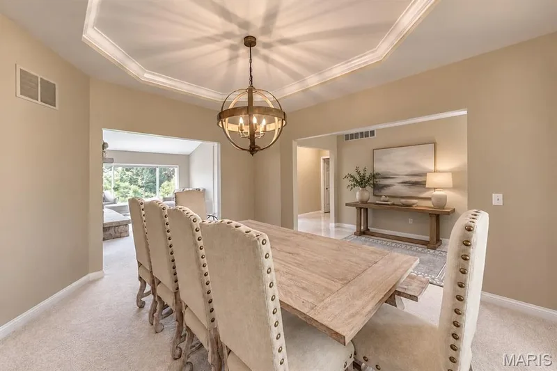 Dining Area open to the Great room and kitchen beyond — 4484 Kingfisher Court, Augusta, MO 63332