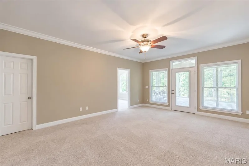 Primary Bedroom with dual walk in closets, private sunporch and ensuite bath — 4484 Kingfisher Court, Augusta, MO 63332