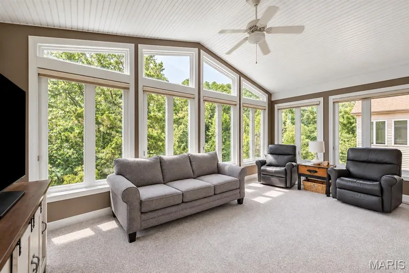 Beautiful sunroom adjacent to the kitchen overlooking the lake — 4484 Kingfisher Court, Augusta, MO 63332