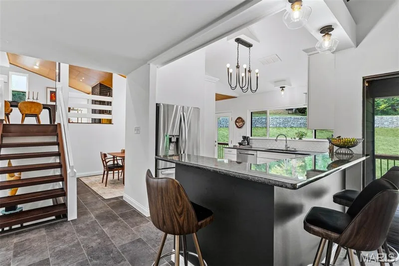 Breakfast with a view—the perfect perch for morning coffee while the woods and lake wake up around you. — 35 Arrowhead Estates Court, Chesterfield, MO 63017