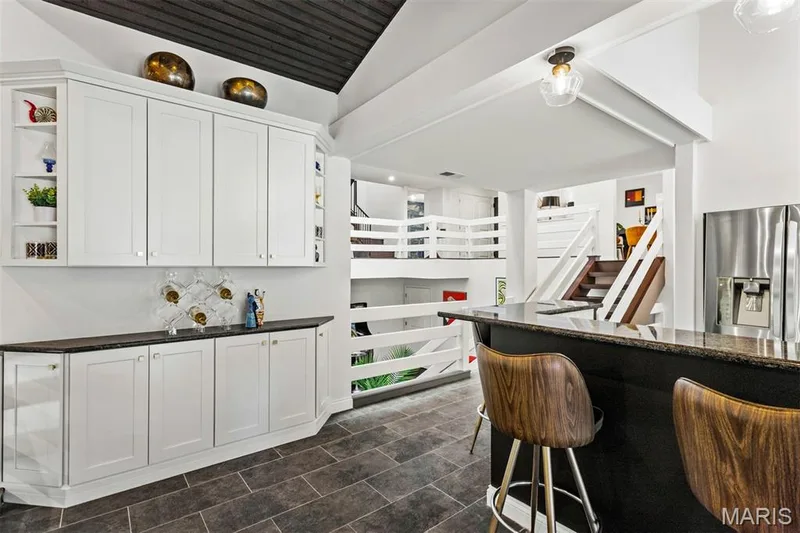 Buffet/coffee bar with ample cabinetry overlooks family room — 35 Arrowhead Estates Court, Chesterfield, MO 63017