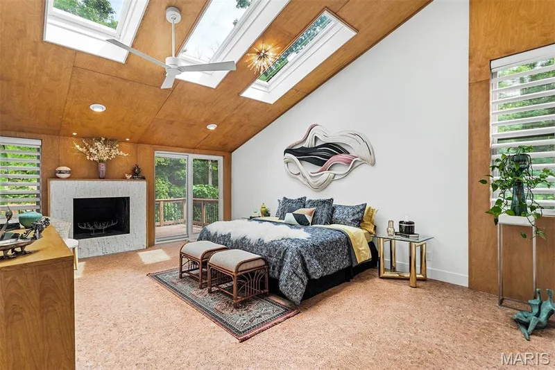 Primary bedroom boasts fireplace, custom woodwork, cork floors, programmable shade skylights — 35 Arrowhead Estates Court, Chesterfield, MO 63017
