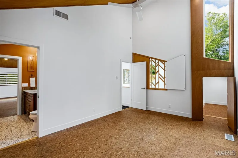 one of 3 upstairs bedrooms; has storage and separate  closet; custom shutters, wood paneling, and full bath — 35 Arrowhead Estates Court, Chesterfield, MO 63017
