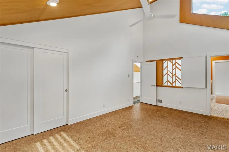 2nd bedroom connects to shared full bath; custom wood screen can be closed for privacy. One side is stationary. — 35 Arrowhead Estates Court, Chesterfield, MO 63017
