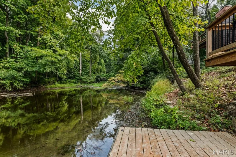 Watch the seasons transform from your private lakeside retreat — 35 Arrowhead Estates Court, Chesterfield, MO 63017
