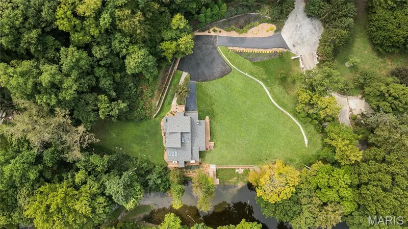Three acres. Private lake. Remarkable architecture. A completely different way to live in Chesterfield. — 35 Arrowhead Estates Court, Chesterfield, MO 63017