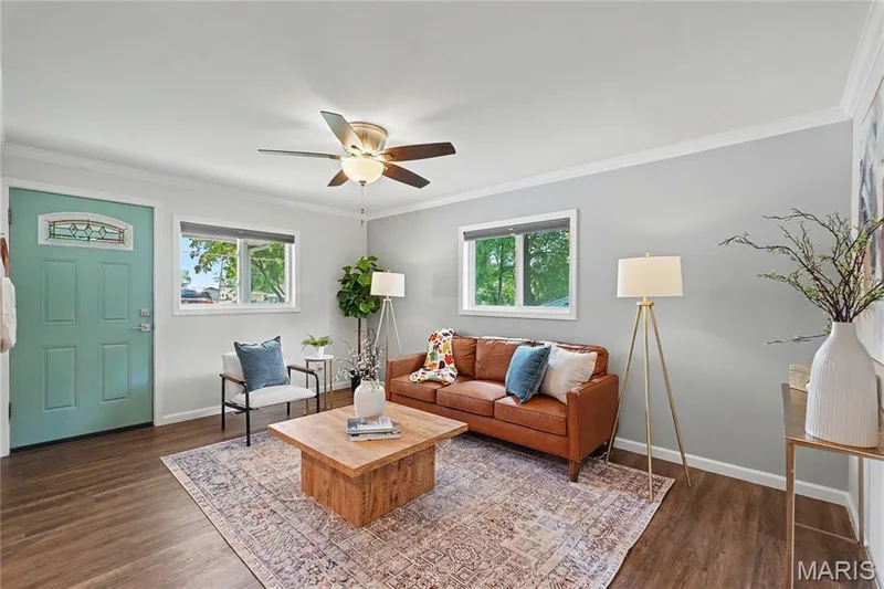 Wood-finish flooring, light gray walls, white trim, and a ceiling fan with integrated lighting — 31 Plackemeier, O'Fallon, MO 63366
