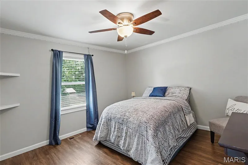 Crown molding accents the ceiling, complemented by wood-finish flooring — 31 Plackemeier, O'Fallon, MO 63366