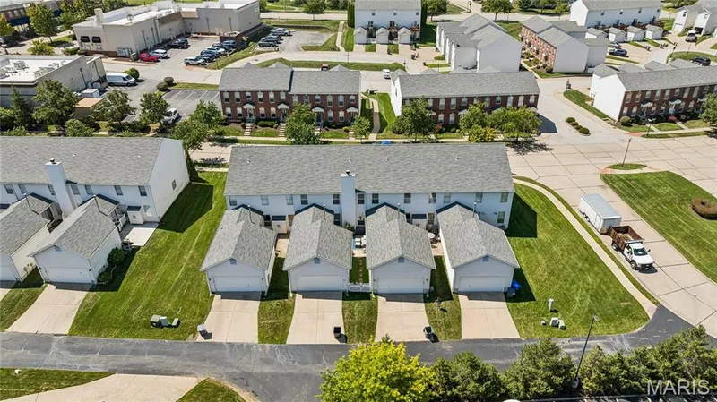 Room to live, room to breathe, and the convenience of townhome living! An attached two-car garage and a well-kept community setting make this a great place to call home. — 947 Rolling Thunder Drive, O'Fallon, MO 63368