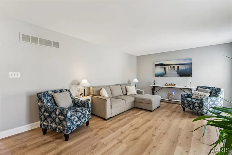 Generously sized and thoughtfully designed, the living room offers plenty of space to gather, relax, and make yourself at home while maintaining an open connection to the rest of the main level. — 947 Rolling Thunder Drive, O'Fallon, MO 63368