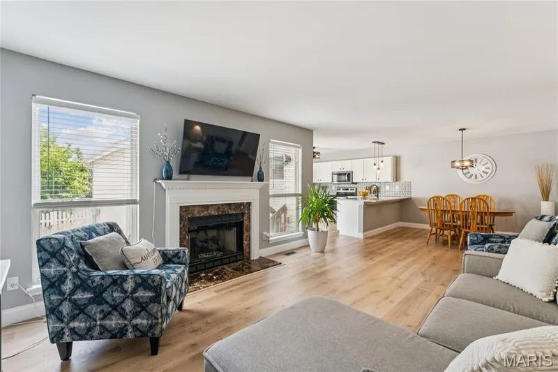 The open layout creates an effortless flow between the living, dining, and kitchen spaces, giving the main level a wonderfully spacious feel. A versatile design that’s equally suited for quiet evenings at home or hosting family and friends. — 947 Rolling Thunder Drive, O'Fallon, MO 63368