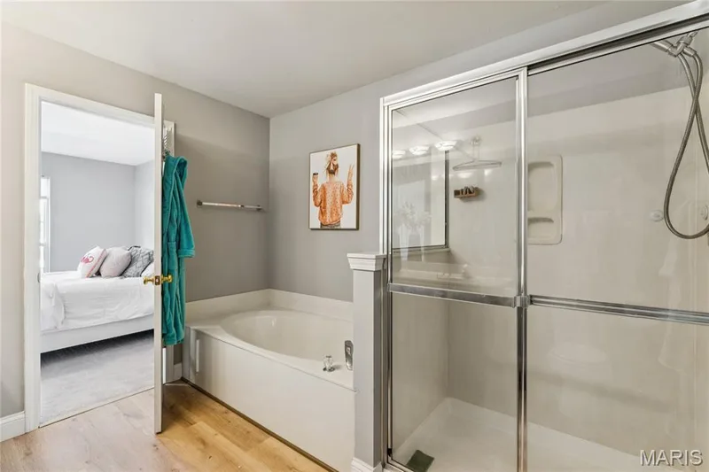 This bathroom blends style and function, making it the perfect space to unwind after a long day. — 947 Rolling Thunder Drive, O'Fallon, MO 63368