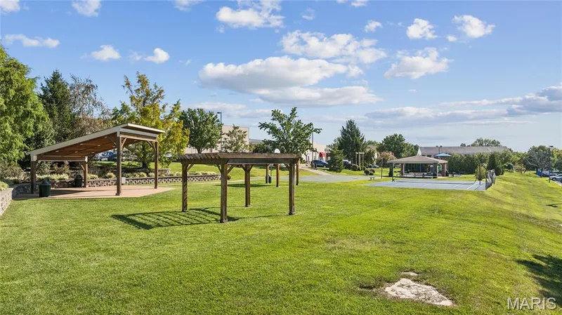 There’s plenty of room to get outside and enjoy the neighborhood, with beautifully maintained green space, shaded gathering areas, and tennis and pickleball courts just moments from home. — 947 Rolling Thunder Drive, O'Fallon, MO 63368