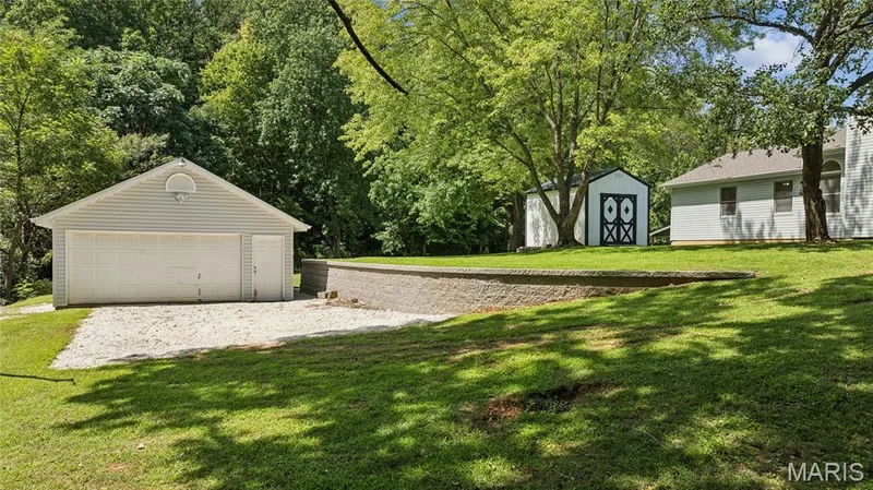 The workshop buyers dream about. A full detached garage with room for tools, toys, or projects, a rare find on a lot like this. — 416 Loiselaine Drive, O'Fallon, MO 63366