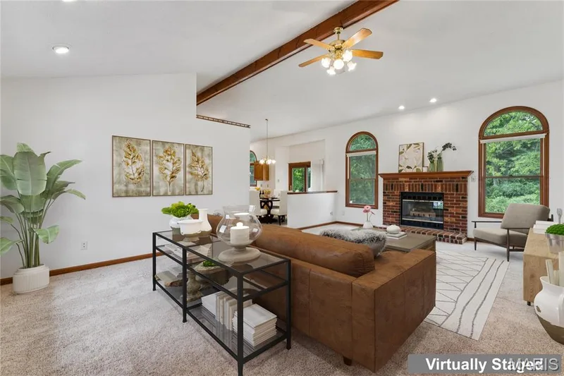 Vaulted ceilings, arched windows, and an open layout set the tone the moment you walk in. — 416 Loiselaine Drive, O'Fallon, MO 63366