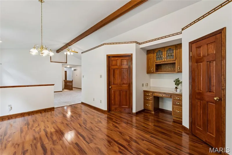 A built-in desk and cabinetry add everyday function right off the kitchen, while a walk-in pantry and main floor laundry sit just steps away, real convenience built right in. — 416 Loiselaine Drive, O'Fallon, MO 63366