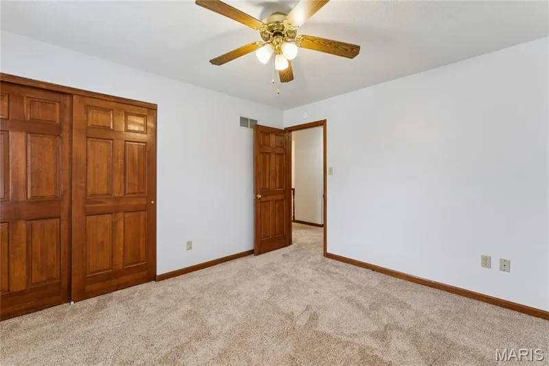 Generous double-door closet space gives this bedroom the storage real life demands, comfortable, functional, and ready for its next owner. — 416 Loiselaine Drive, O'Fallon, MO 63366